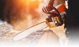 chainsaw cutting a log